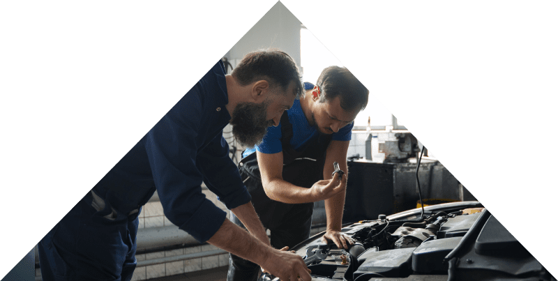 Car Mechanics Working On Engine Car Mechanics Working On Engine